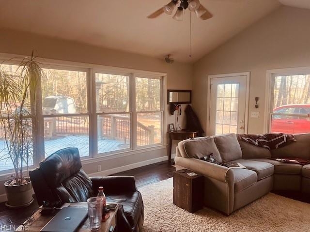 living room featuring hardwood / wood-style floors, ceiling fan, and lofted ceiling