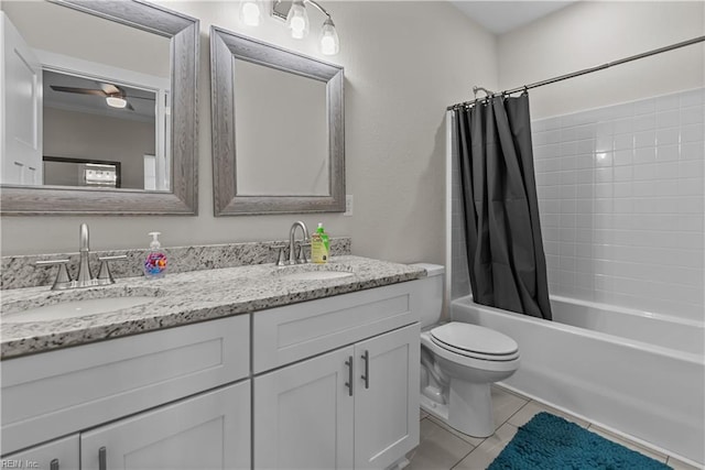 full bathroom featuring vanity, tile patterned floors, ceiling fan, toilet, and shower / tub combo with curtain