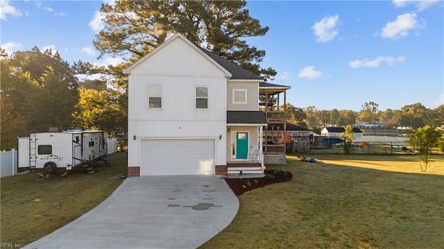 view of front of house featuring a front lawn and a garage