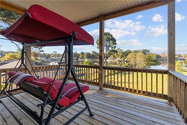 wooden deck featuring a water view