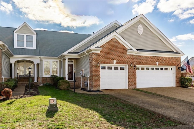 view of front of house with a front lawn and a garage