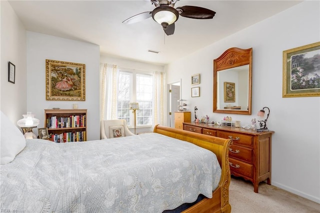 bedroom featuring ceiling fan and light carpet