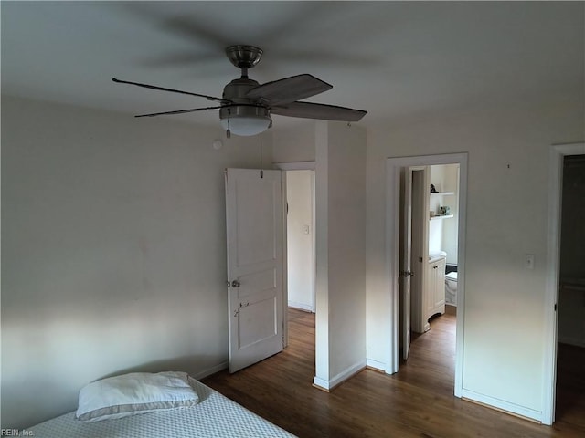 unfurnished bedroom featuring ceiling fan, dark hardwood / wood-style floors, and ensuite bath