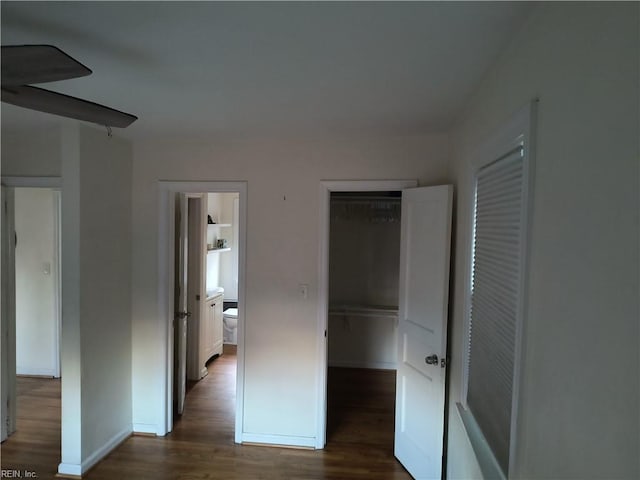 hallway featuring dark wood-type flooring