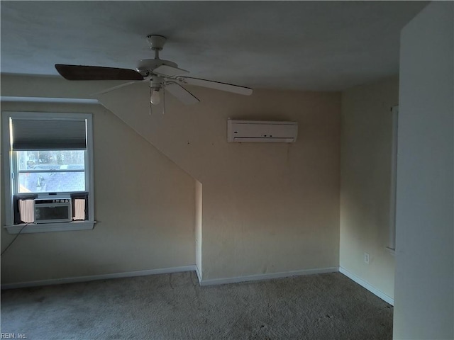 empty room featuring lofted ceiling, cooling unit, ceiling fan, carpet floors, and a wall unit AC