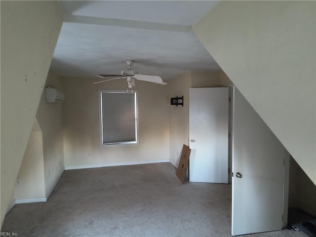 bonus room featuring a wall mounted air conditioner, carpet flooring, and ceiling fan