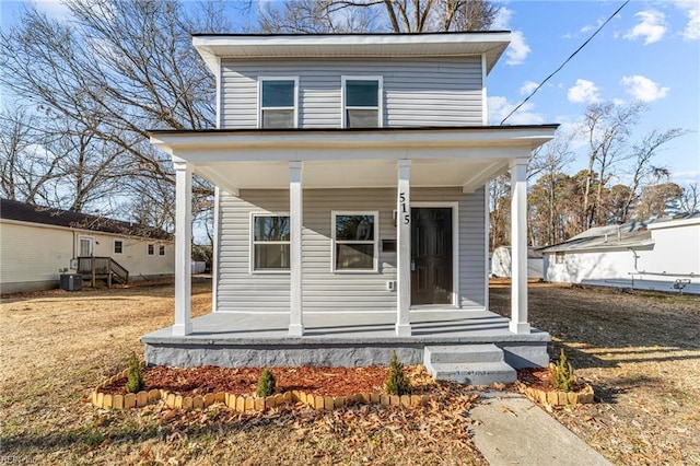 view of front facade featuring covered porch and central AC unit