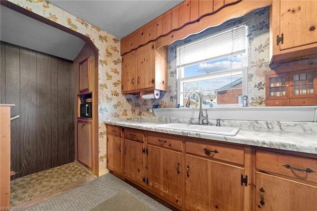 kitchen with light tile patterned floors and sink