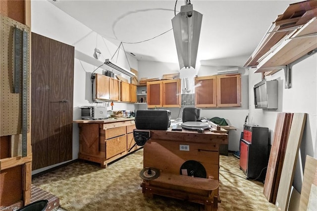 kitchen with light colored carpet and vaulted ceiling