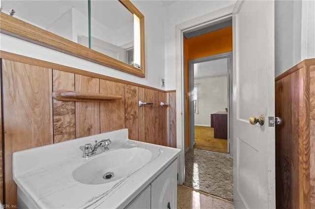 bathroom featuring tile patterned flooring and vanity