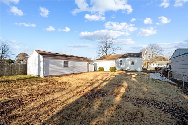 back of property with an outbuilding