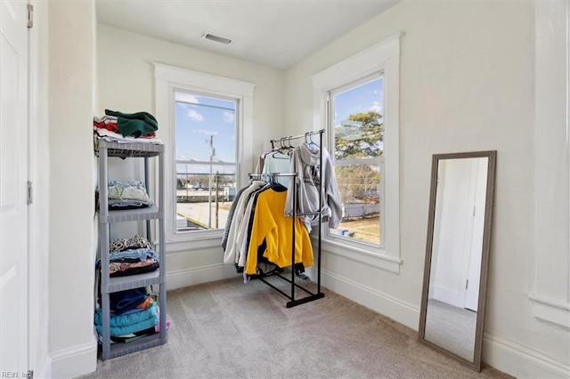 interior space featuring light colored carpet