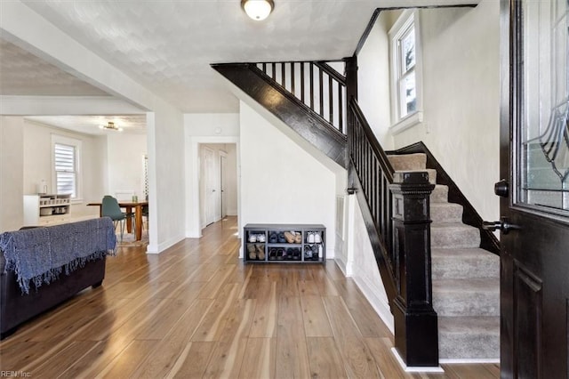 stairway featuring hardwood / wood-style floors