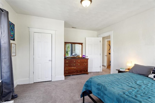 bedroom featuring light colored carpet