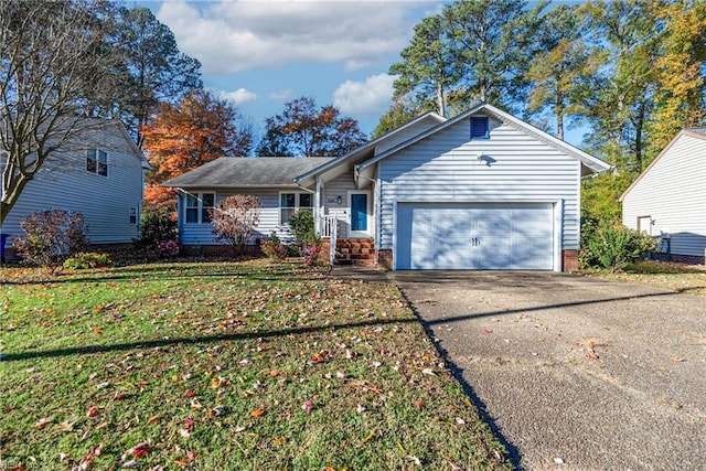 ranch-style home with a garage and a front yard