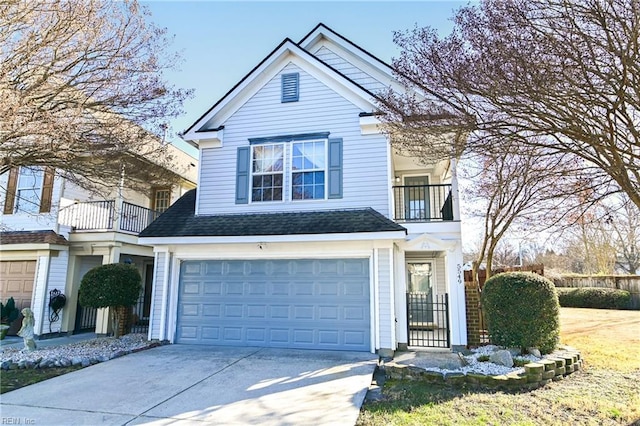 view of front of property featuring a garage and a balcony