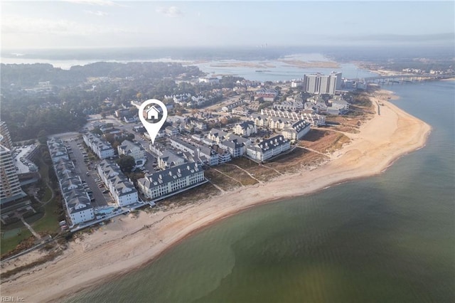 aerial view featuring a water view and a beach view