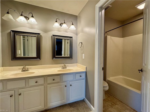 full bathroom with tile patterned flooring, bathtub / shower combination, vanity, and toilet