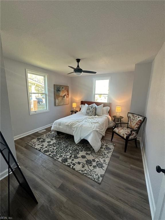 bedroom featuring ceiling fan and dark hardwood / wood-style flooring