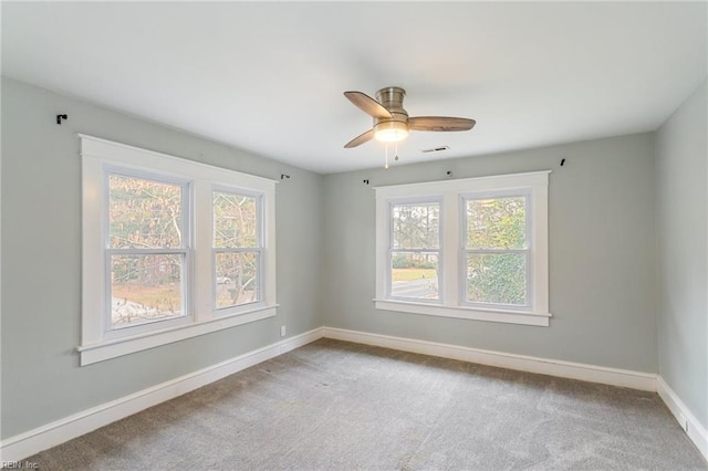 carpeted empty room with ceiling fan