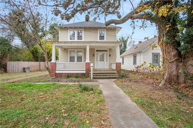 view of front of home featuring a porch and a front yard