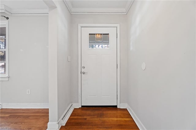 doorway featuring a baseboard heating unit, dark hardwood / wood-style floors, and crown molding