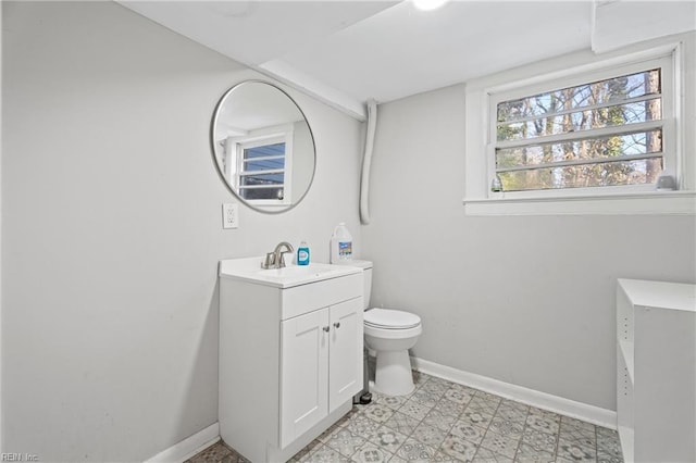 bathroom featuring toilet and vanity