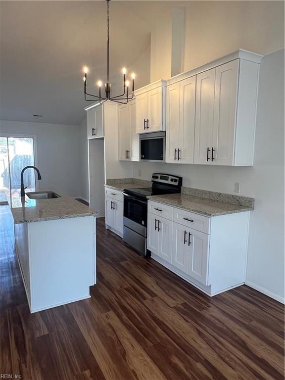 kitchen featuring pendant lighting, a kitchen island with sink, white cabinets, sink, and appliances with stainless steel finishes