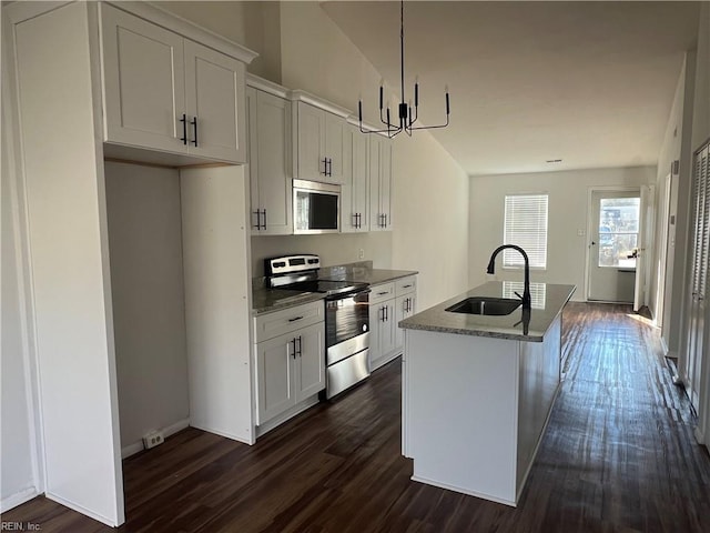 kitchen with white cabinets, sink, an island with sink, and appliances with stainless steel finishes