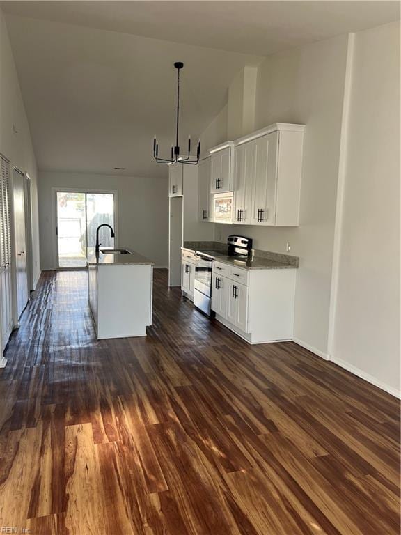 kitchen with stainless steel range with electric stovetop, white cabinetry, a kitchen island with sink, and dark wood-type flooring