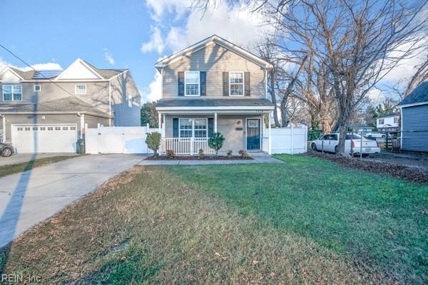 view of front property with covered porch and a front yard