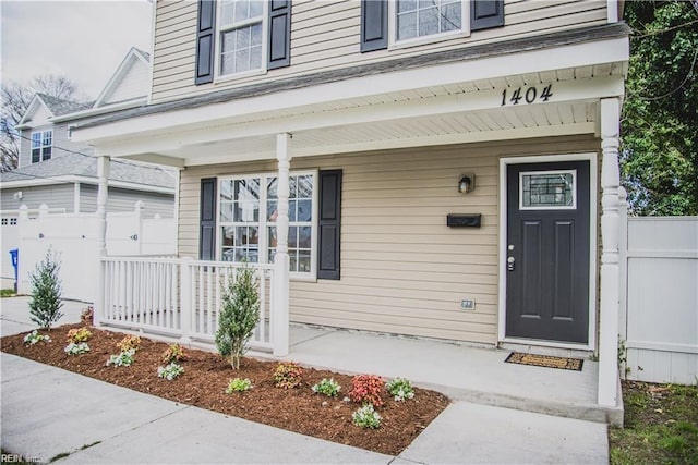 property entrance with covered porch