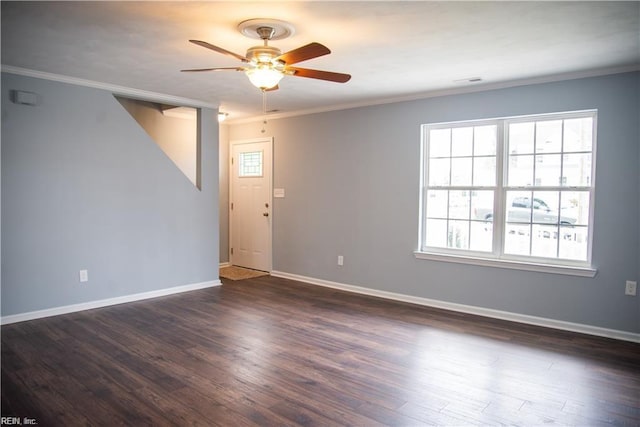 unfurnished room featuring dark hardwood / wood-style floors, ceiling fan, and ornamental molding