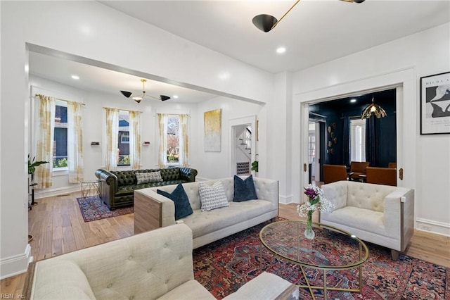 living room with plenty of natural light and light hardwood / wood-style floors