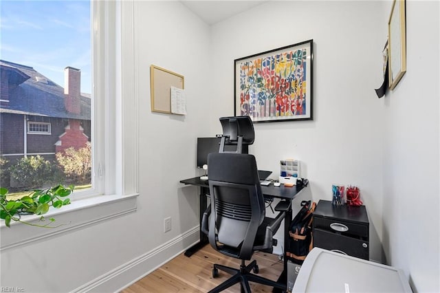 office area with hardwood / wood-style flooring