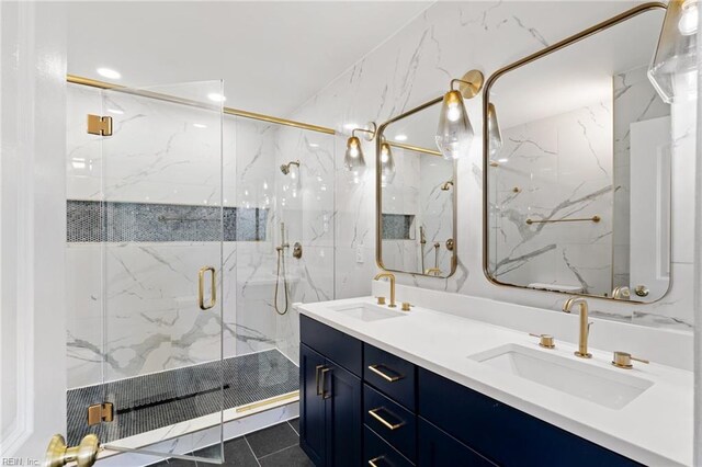 bathroom with tile patterned flooring, vanity, and a shower with shower door