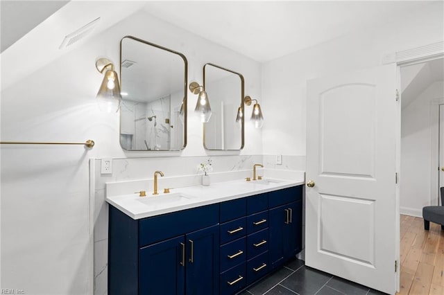 bathroom with tile patterned floors and vanity