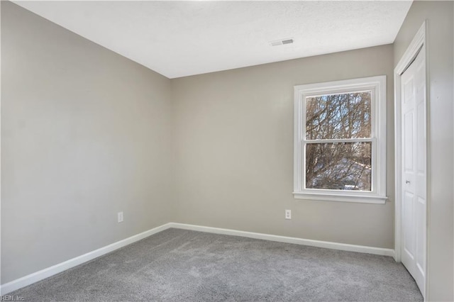 unfurnished room featuring carpet floors