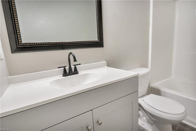 bathroom featuring vanity and toilet