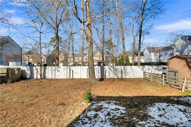 view of yard layered in snow