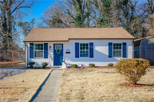 view of front of home with a front lawn