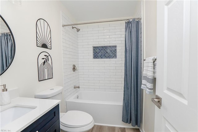 full bathroom with wood-type flooring, vanity, toilet, and shower / bath combo with shower curtain