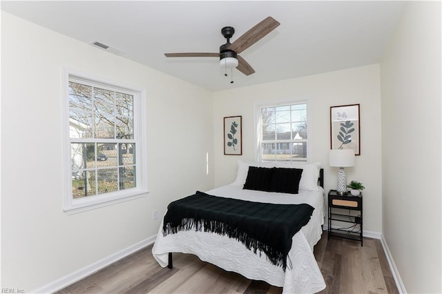 bedroom featuring hardwood / wood-style floors and ceiling fan