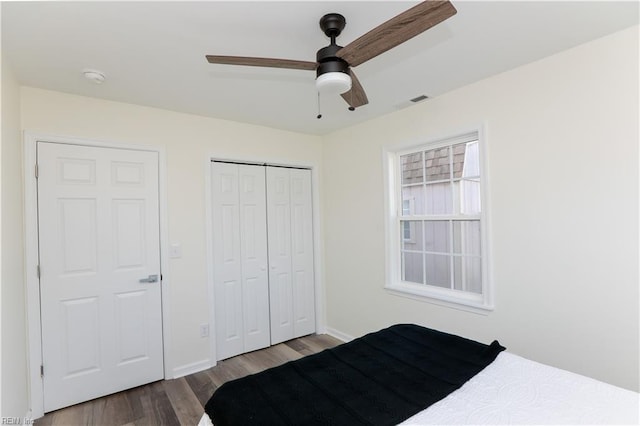 unfurnished bedroom featuring hardwood / wood-style floors and ceiling fan