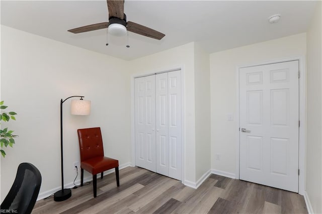 interior space with hardwood / wood-style floors and ceiling fan