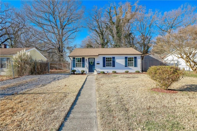 ranch-style home with a front lawn