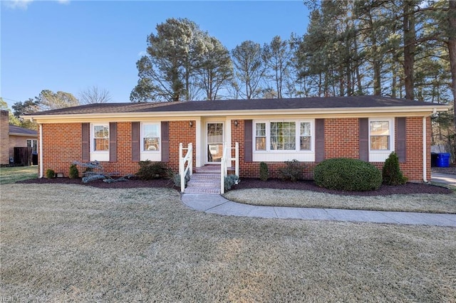 ranch-style home with a front yard