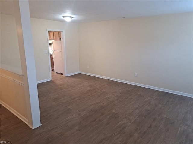 unfurnished room featuring dark hardwood / wood-style floors