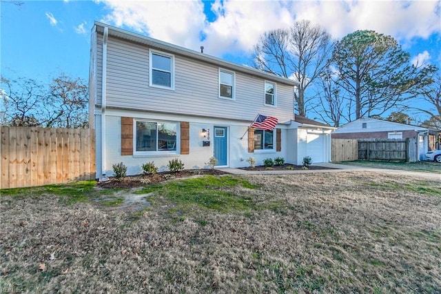 view of front of home with a front lawn and a garage