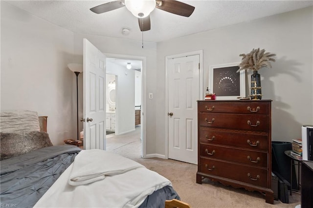 bedroom featuring light carpet and ceiling fan